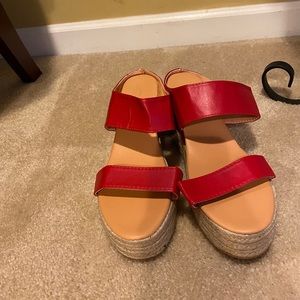 Red slip on sandals with 2-inch espadrille.